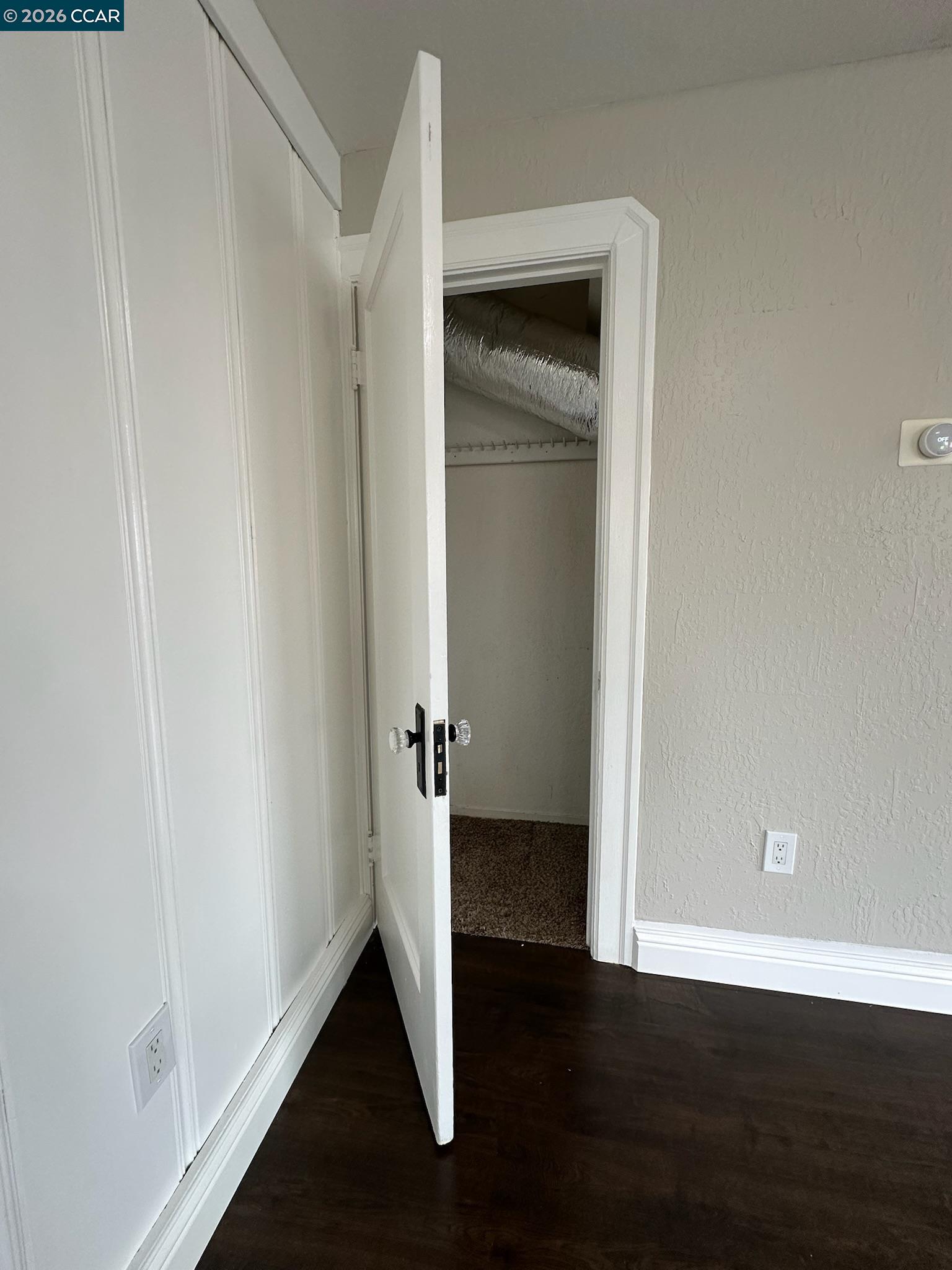 315 West 3rd Street, Unit B Antioch, CA 94509 - Photo 22 of 41 a view of an empty room with wooden floor and a hallway