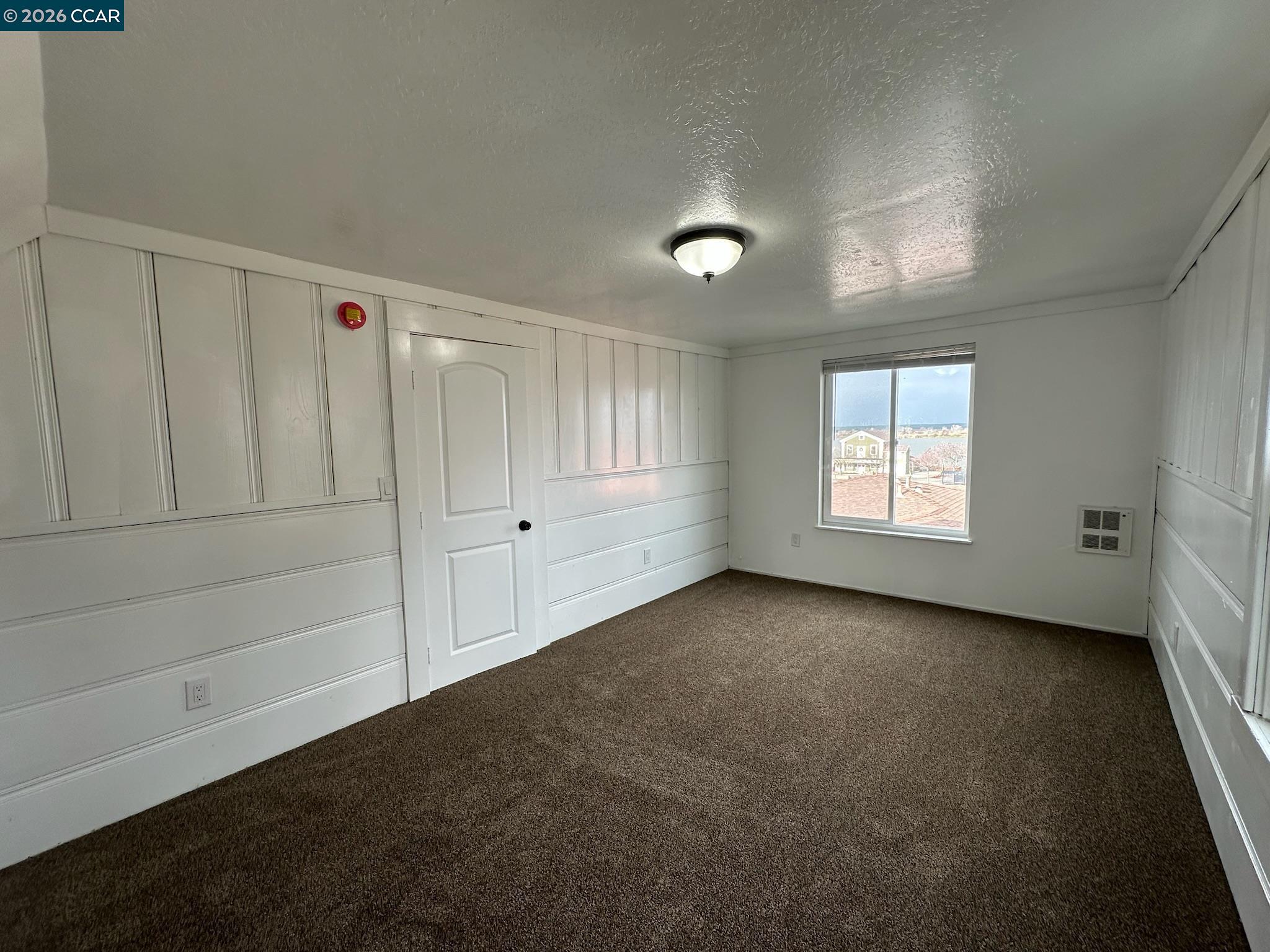 315 West 3rd Street, Unit B Antioch, CA 94509 - Photo 30 of 41 a view of an empty room with a window