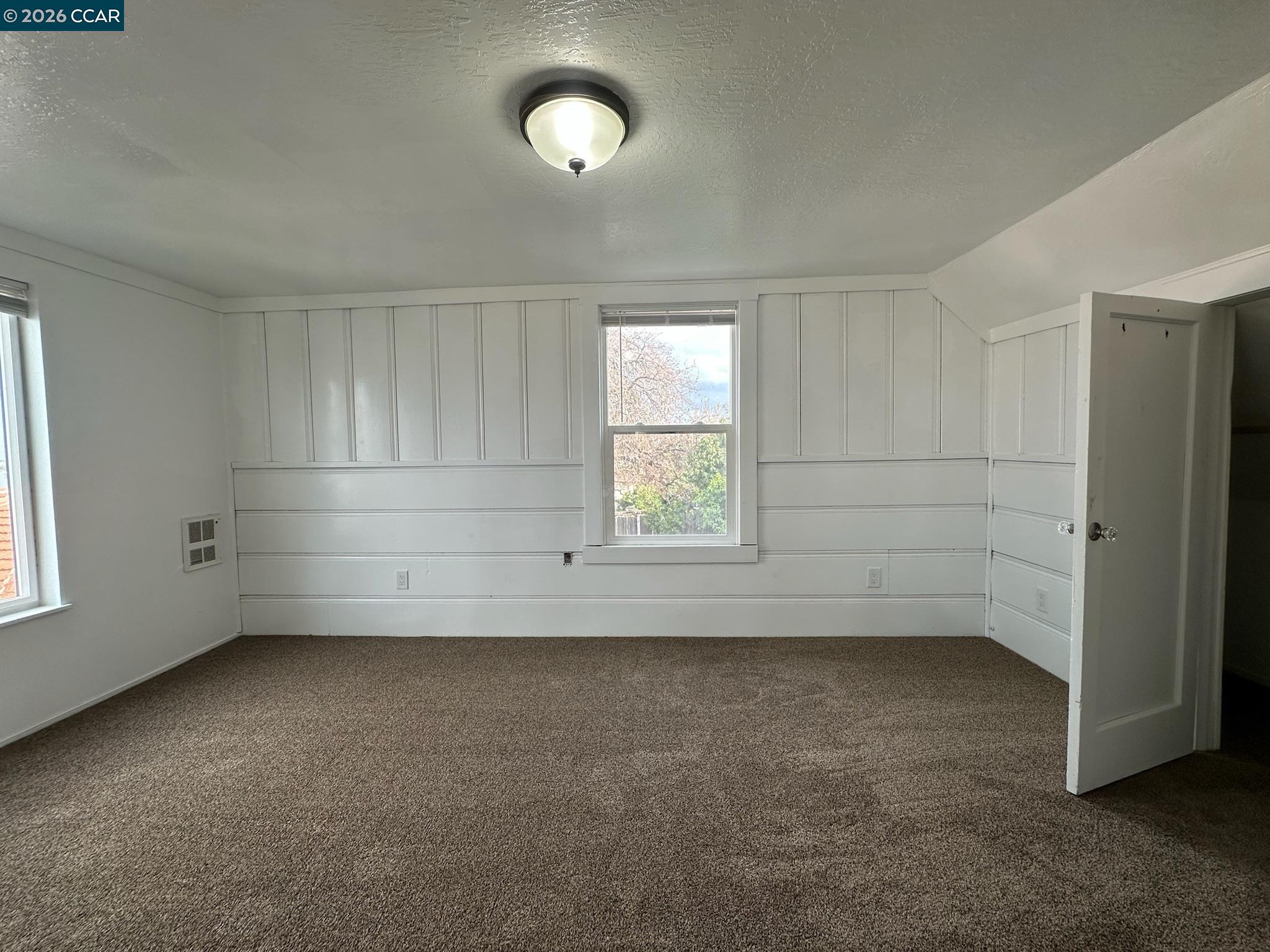 315 West 3rd Street, Unit B Antioch, CA 94509 - Photo 34 of 41 an empty room with a empty space and windows