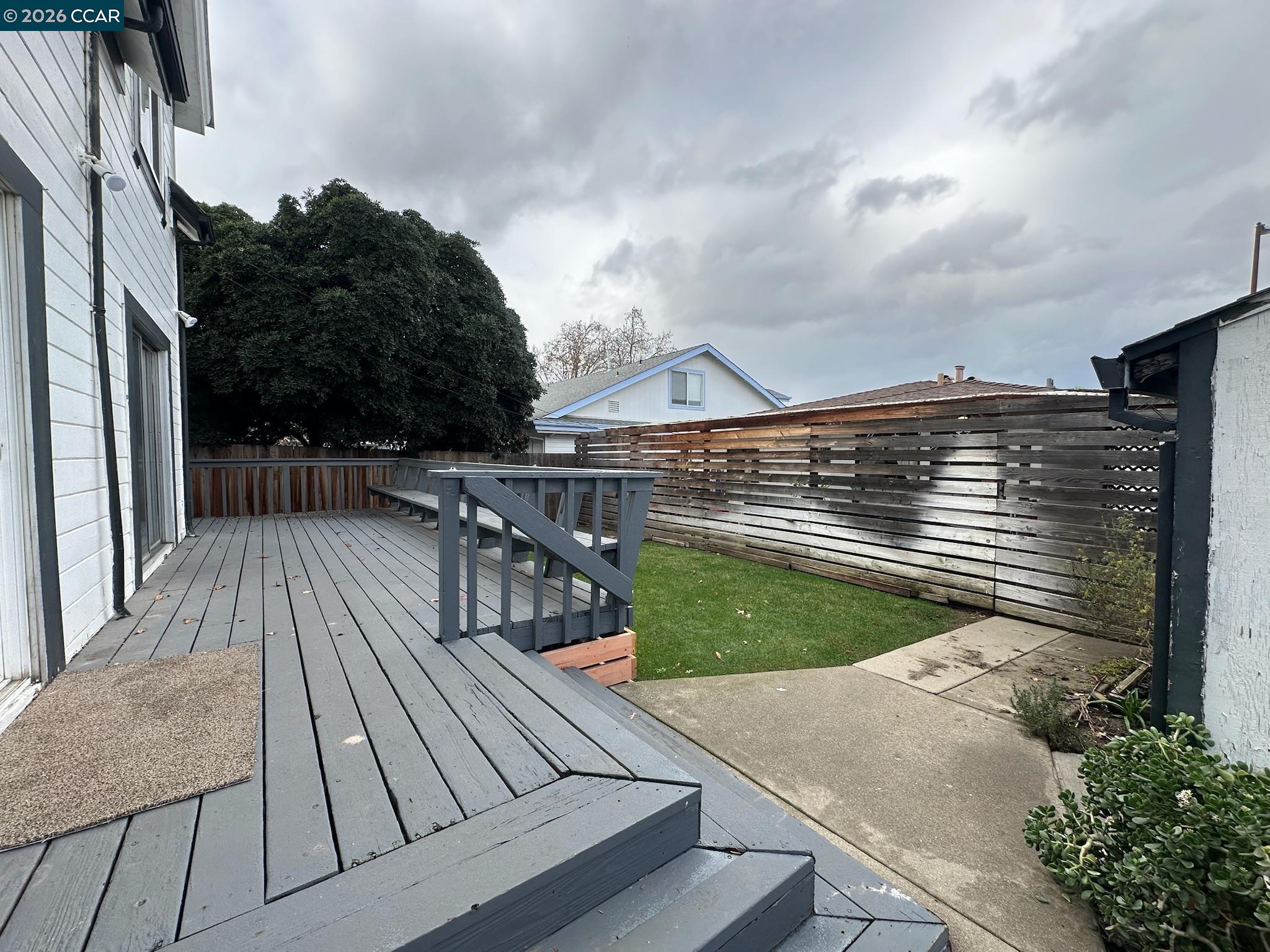 315 West 3rd Street, Unit B Antioch, CA 94509 - Photo 5 of 41 a view of roof deck with two couches and wooden floor