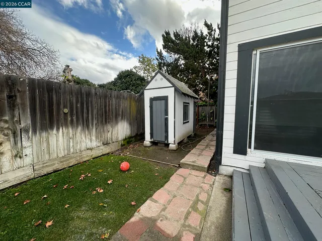 a backyard of a house with seating space