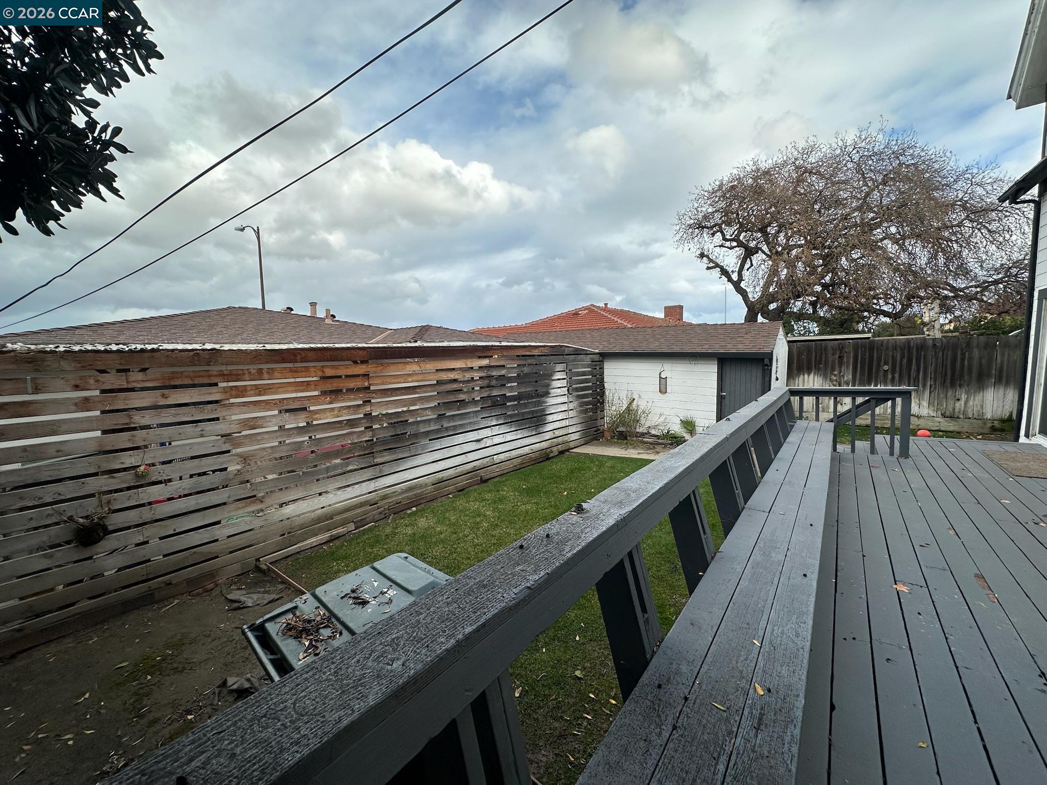 315 West 3rd Street, Unit B Antioch, CA 94509 - Photo 7 of 41 a view of a roof deck with wooden floor and fence