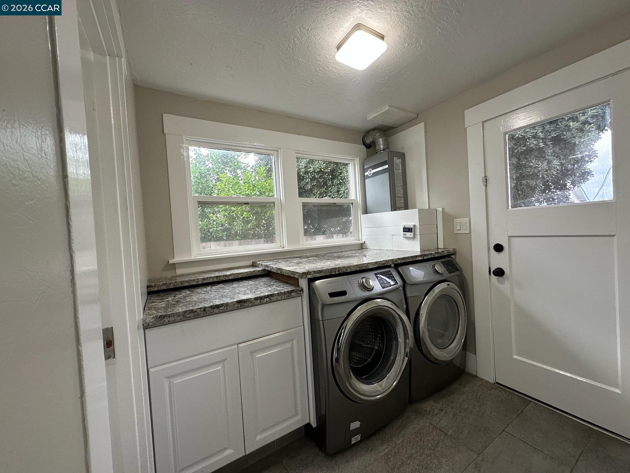 315 West 3rd Street, Unit B Antioch, CA 94509 - Photo 9 of 41 a utility room with sink dryer and washer