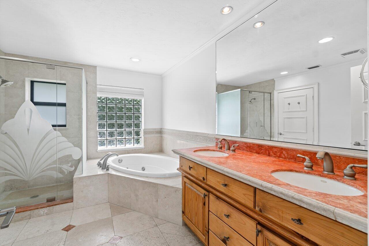 3523 Pine Haven Circle Boca Raton, FL 33431 - Photo 18 of 42 a spacious bathroom with a granite countertop tub sink and mirror