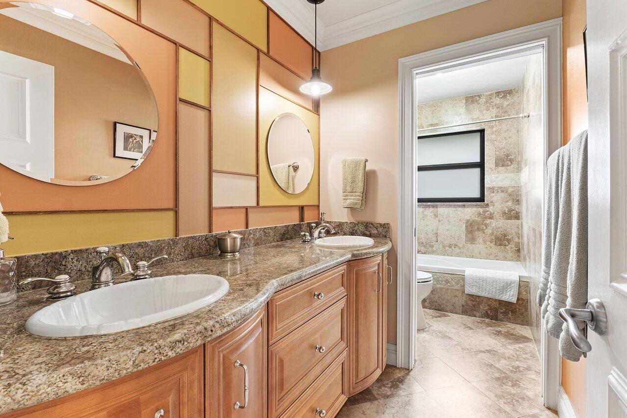 3523 Pine Haven Circle Boca Raton, FL 33431 - Photo 23 of 42 a bathroom with a sink double vanity and a mirror