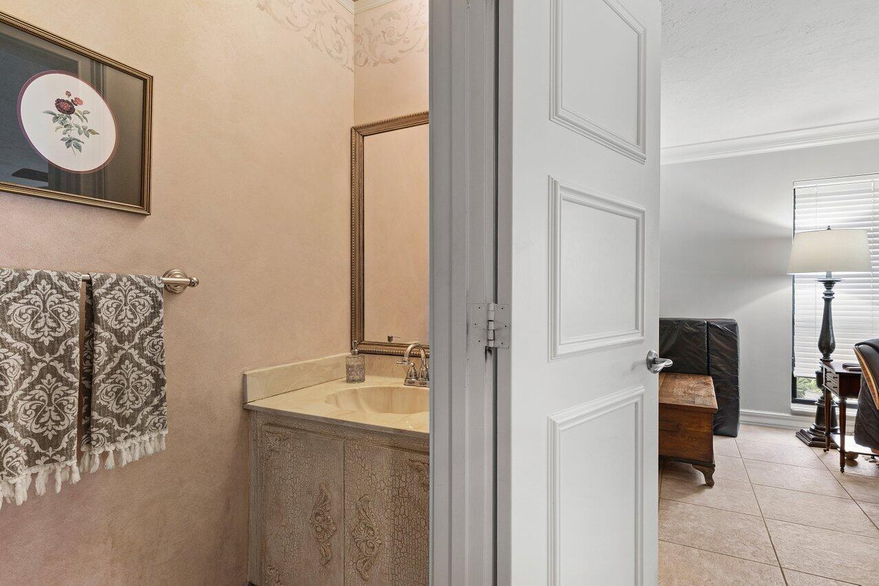 3523 Pine Haven Circle Boca Raton, FL 33431 - Photo 24 of 42 a bathroom with a sink and a mirror