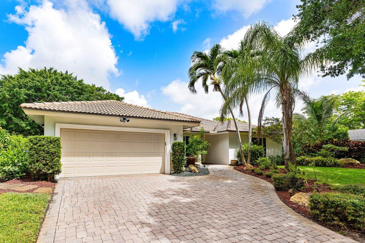 3523 Pine Haven Circle Boca Raton, FL 33431 - Photo 3 of 42 a front view of a house with a yard and garage