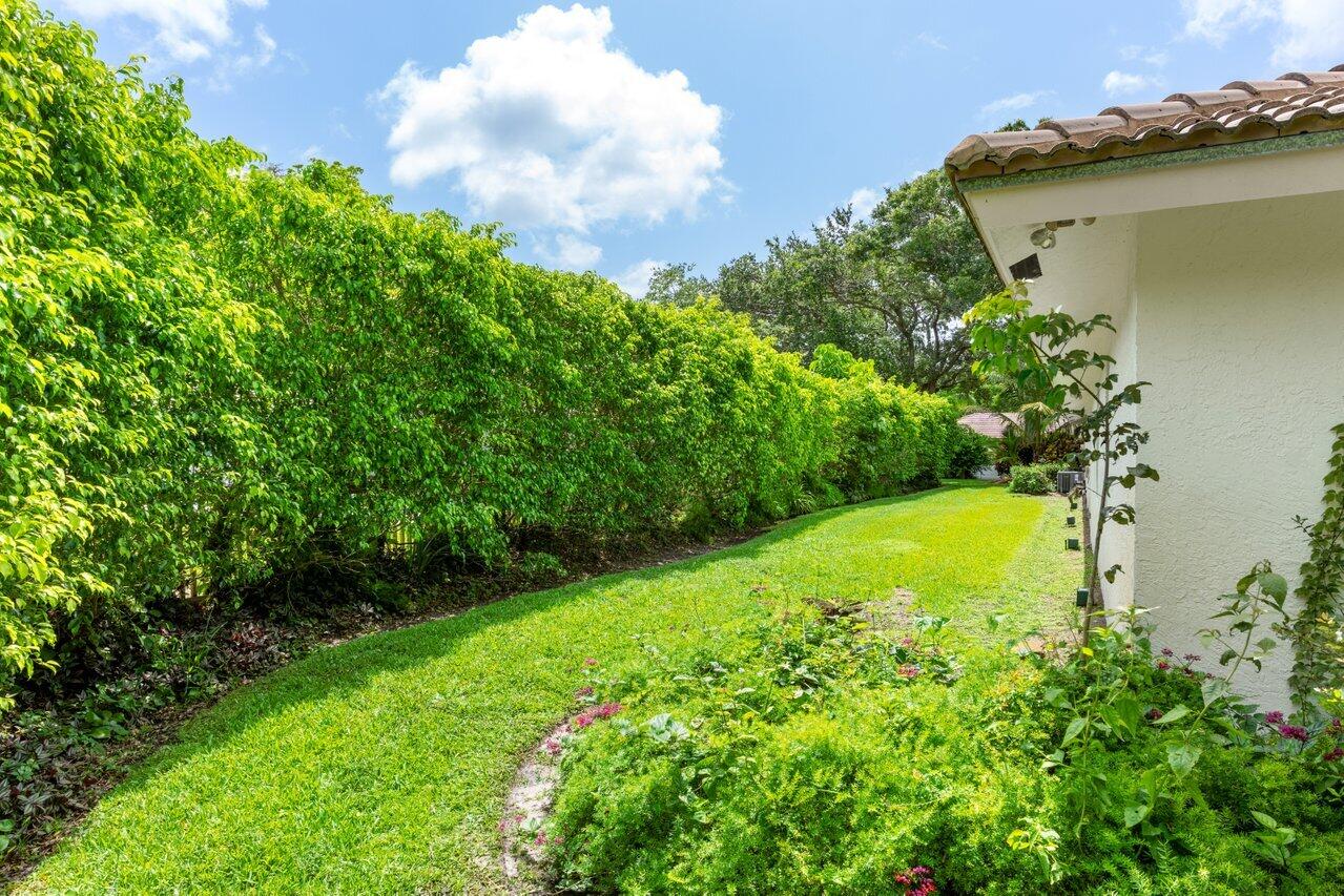 3523 Pine Haven Circle Boca Raton, FL 33431 - Photo 33 of 42 a view of a garden with a lake