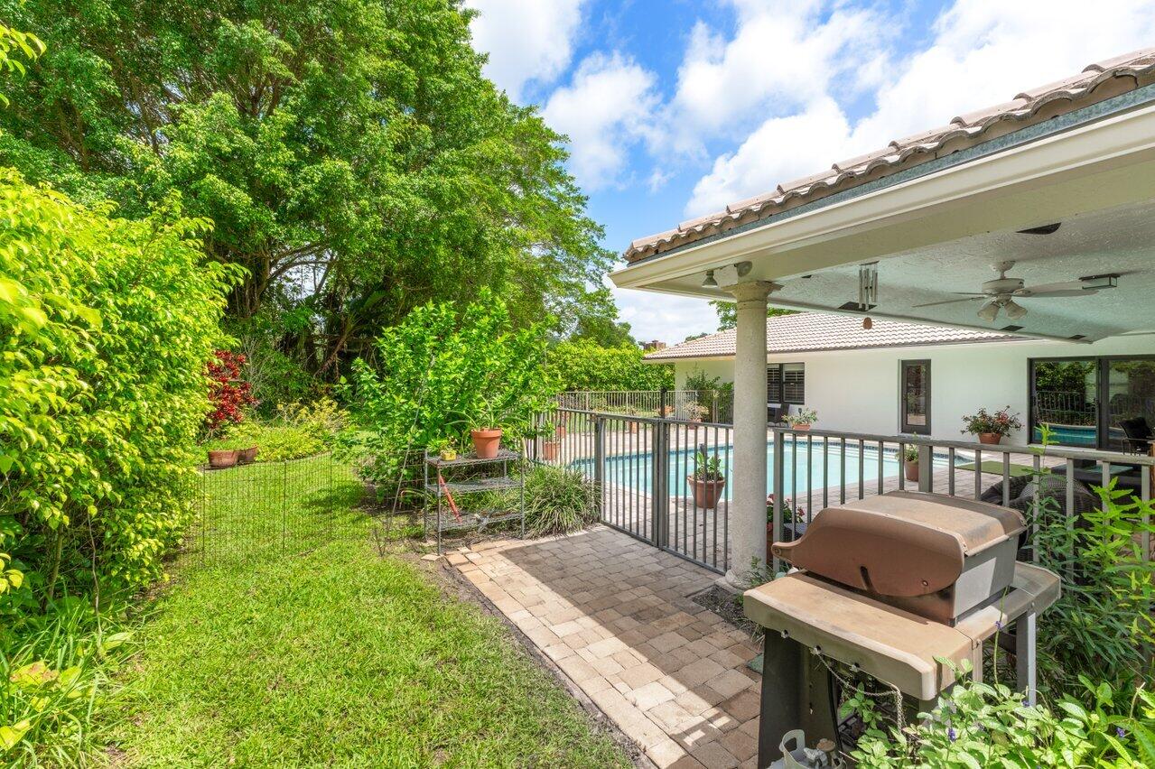3523 Pine Haven Circle Boca Raton, FL 33431 - Photo 34 of 42 a view of a house with backyard and porch