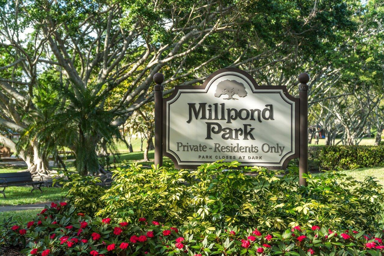 3523 Pine Haven Circle Boca Raton, FL 33431 - Photo 36 of 42 a sign of golf club on a wall under a tree