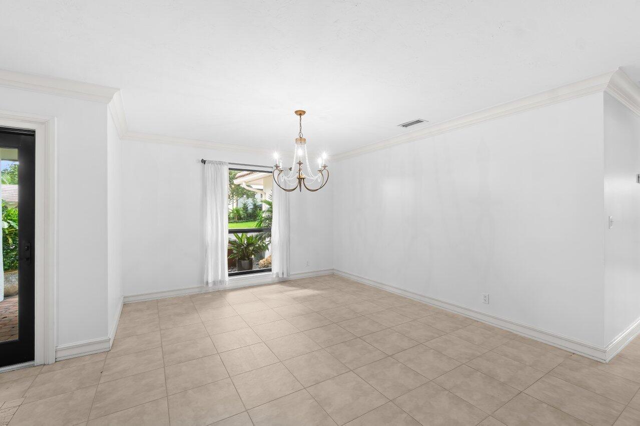 3523 Pine Haven Circle Boca Raton, FL 33431 - Photo 6 of 42 an empty room with windows and fan