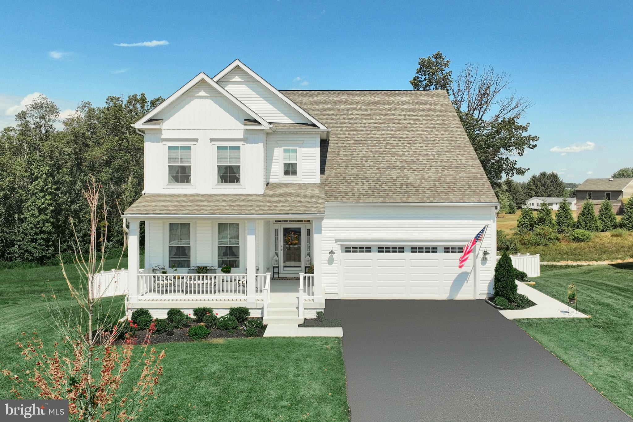 130 Pheasant Ridge Road Hanover, PA 17331 - Photo 1 of 59 a front view of a house with a yard