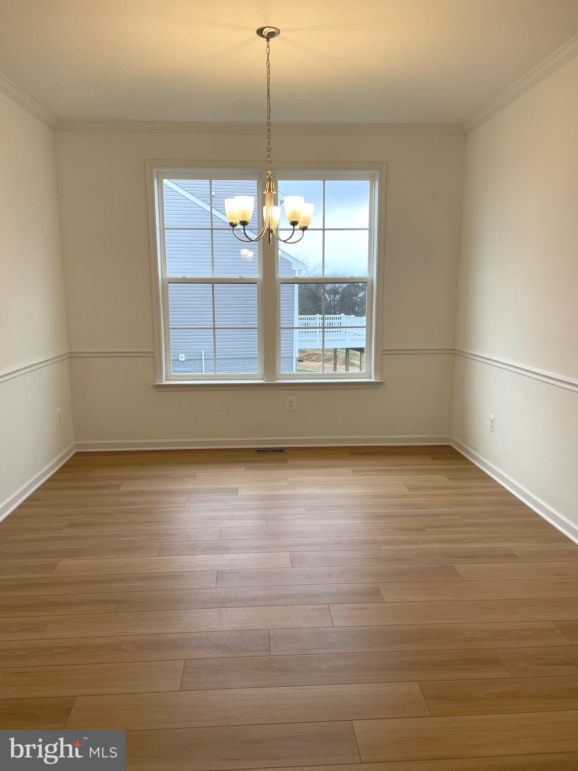 130 Pheasant Ridge Road Hanover, PA 17331 - Photo 17 of 59 a view of an empty room with wooden floor and a window