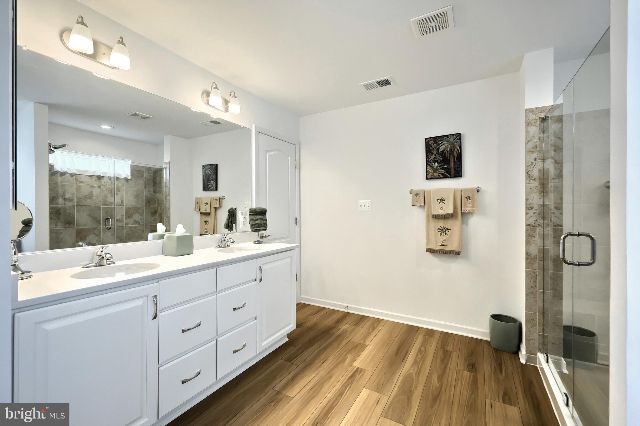 130 Pheasant Ridge Road Hanover, PA 17331 - Photo 24 of 59 a spacious bathroom with a double vanity sink a mirror and shower