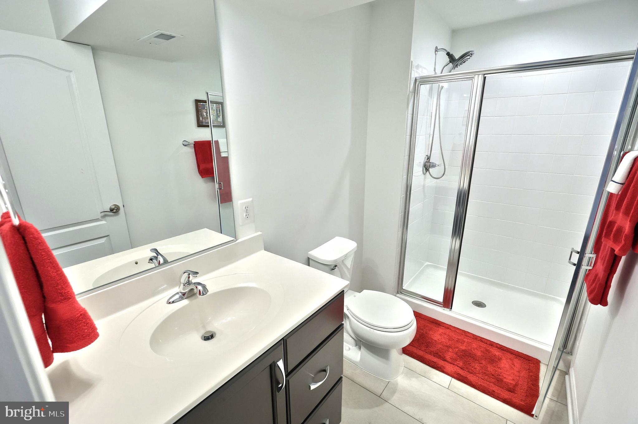 130 Pheasant Ridge Road Hanover, PA 17331 - Photo 34 of 59 a bathroom with a sink vanity mirror and toilet