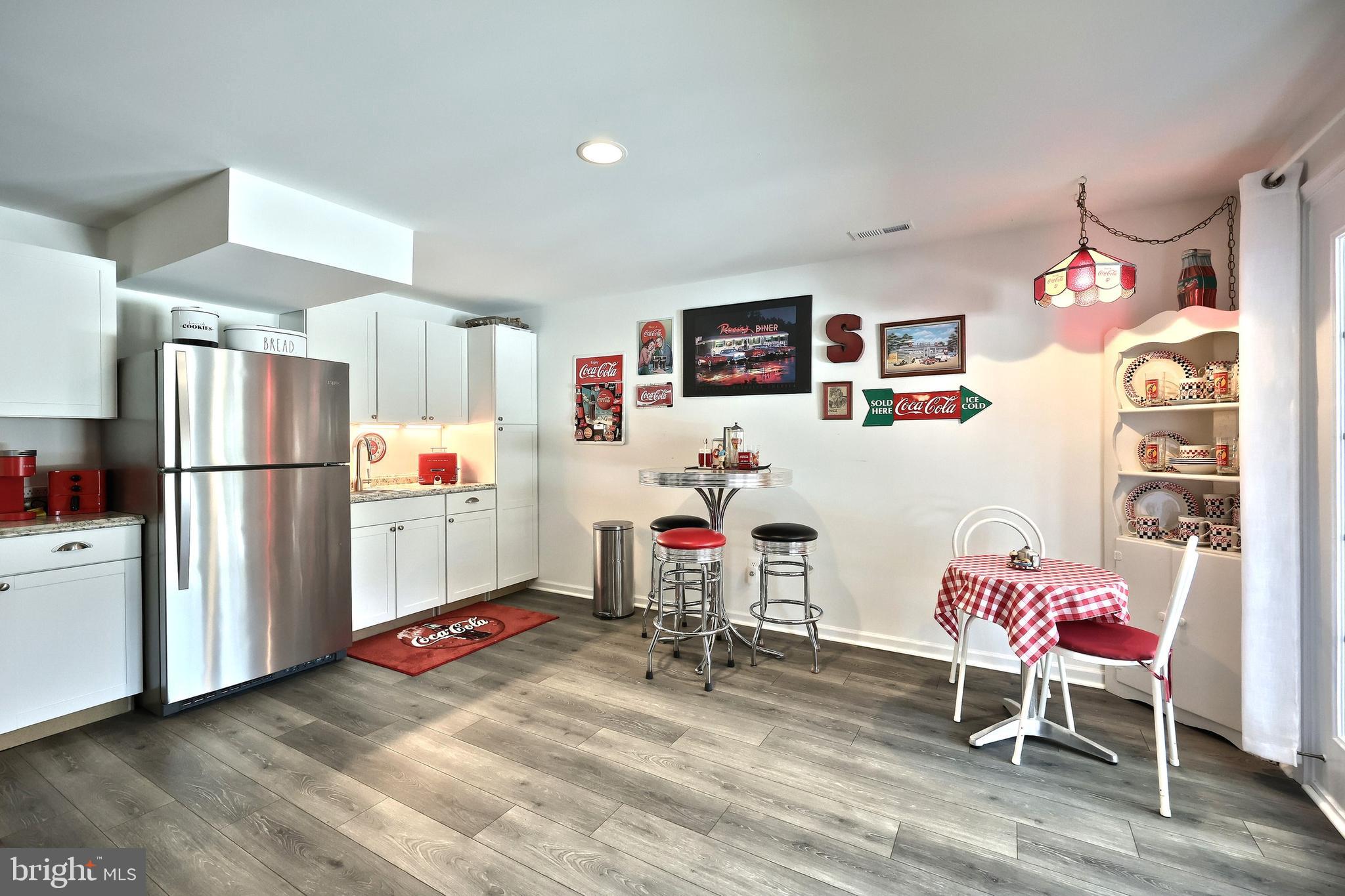 130 Pheasant Ridge Road Hanover, PA 17331 - Photo 35 of 59 a living room with furniture and a refrigerator