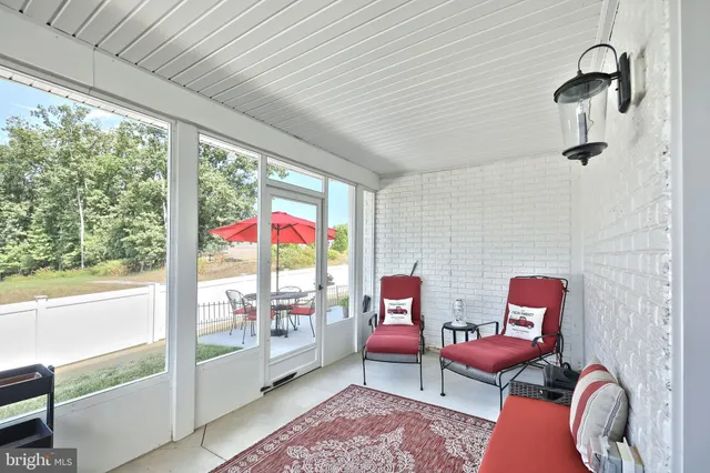 a view of a table and chairs under an umbrella
