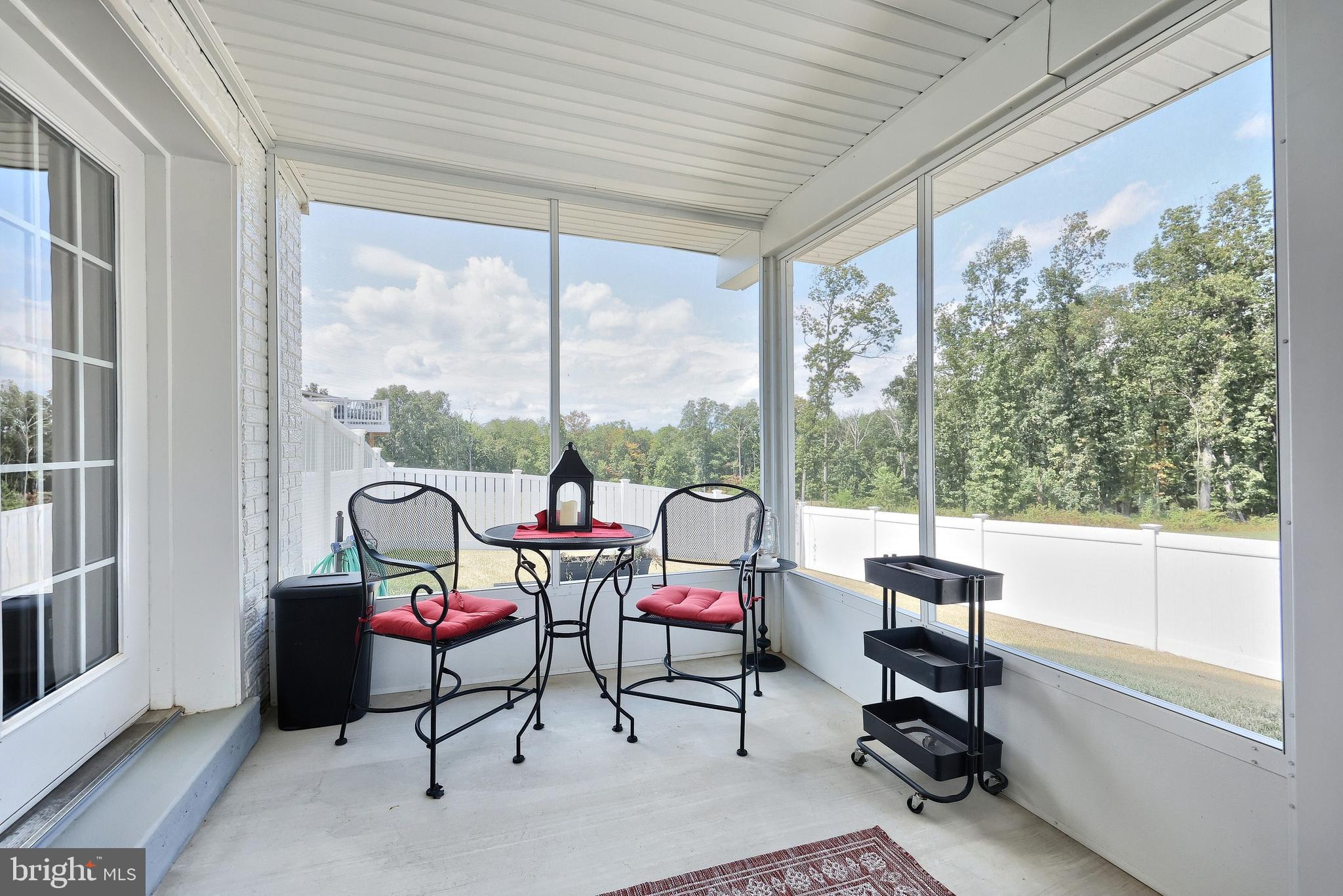 130 Pheasant Ridge Road Hanover, PA 17331 - Photo 38 of 59 a living room filled with furniture and a floor to ceiling window