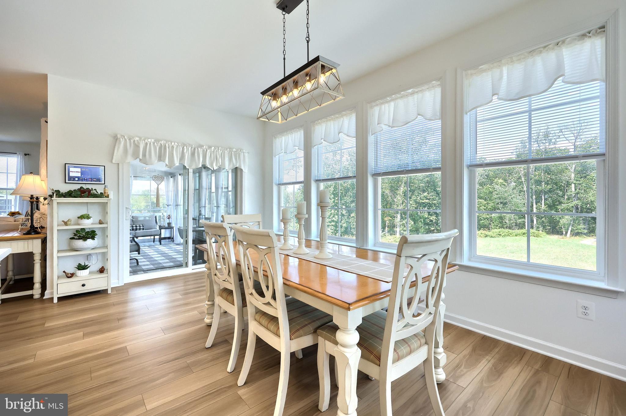 130 Pheasant Ridge Road Hanover, PA 17331 - Photo 10 of 59 a view of a dining room with furniture window and wooden floor