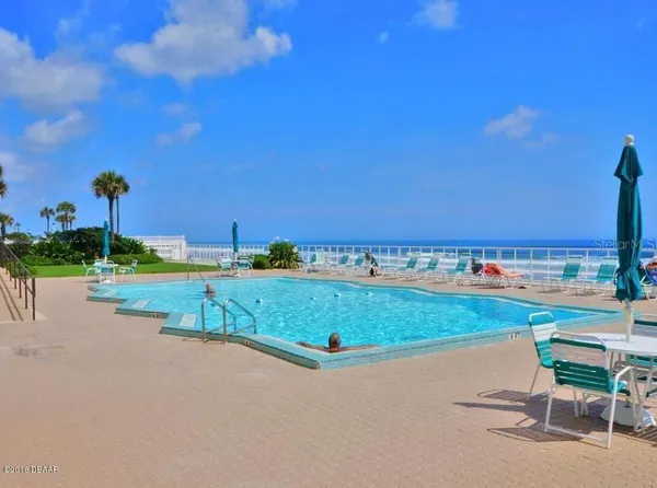 a view of a swimming pool and outdoor space