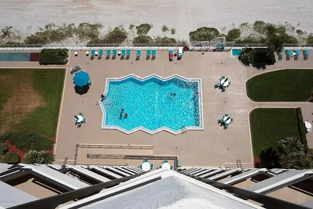 an aerial view of houses with yard