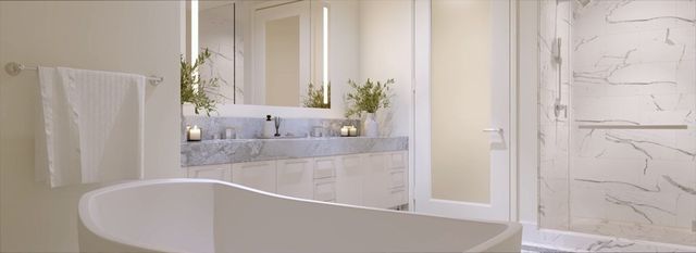 a bathroom with bathtub and window