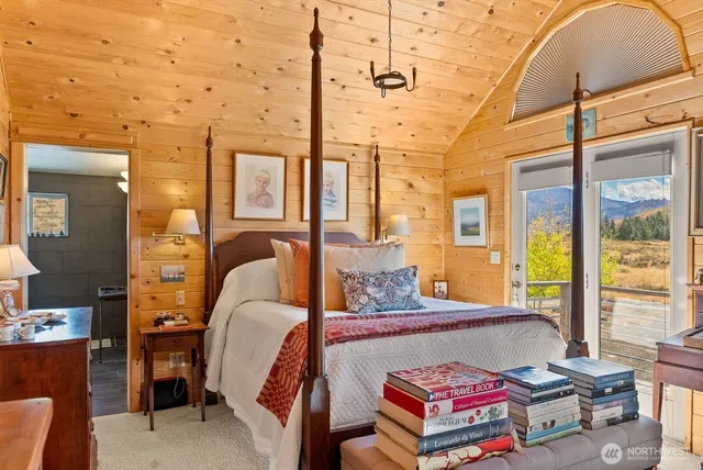 an aerial view of houses with a yard