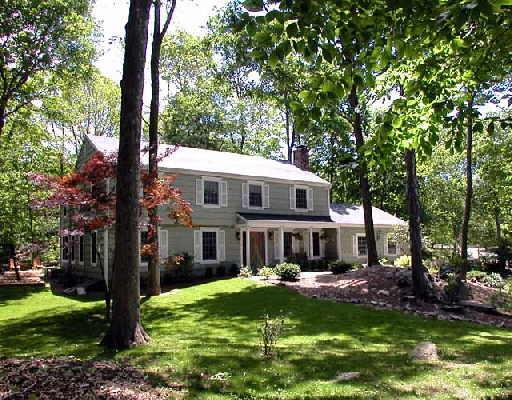 4 Ledge Brook Road Stamford, CT 06903 - Photo 1 of 1 a front view of house with yard and green space