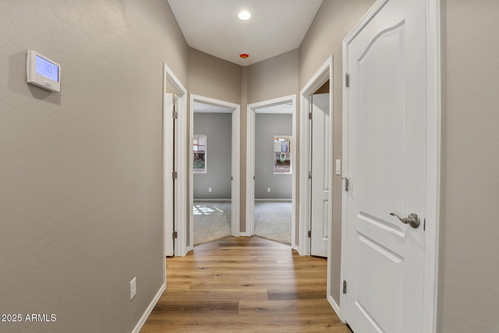 1019 South Ponderosa Street Payson, AZ 85541 - Photo 17 of 34 a view of a hallway with wooden floor and a bathroom