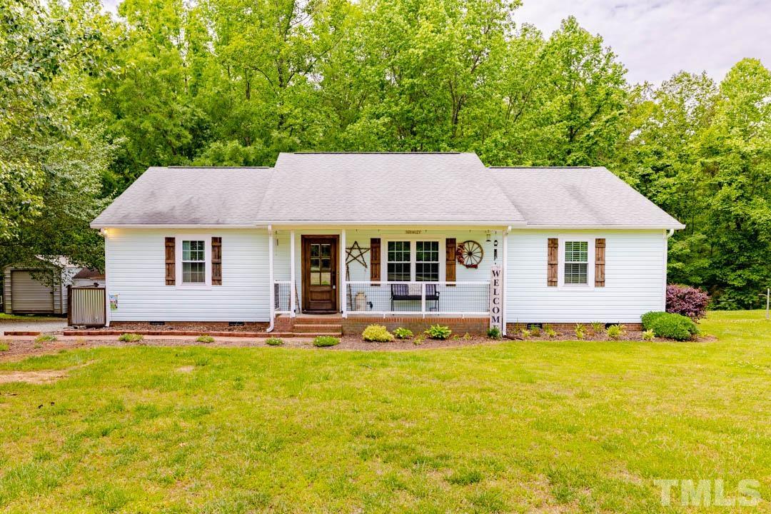 9622 Sawyer Road Rougemont, NC 27572 - Photo 1 of 34 a front view of a house with yard and green space