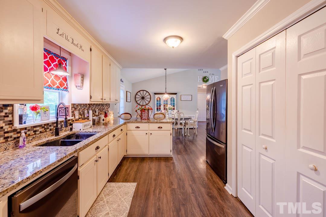 9622 Sawyer Road Rougemont, NC 27572 - Photo 17 of 34 a kitchen with a refrigerator and a sink