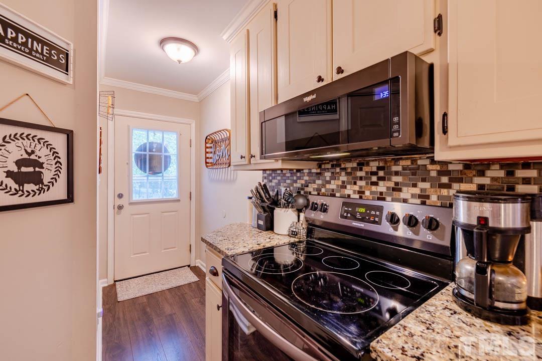 9622 Sawyer Road Rougemont, NC 27572 - Photo 18 of 34 a kitchen with a stove and a microwave