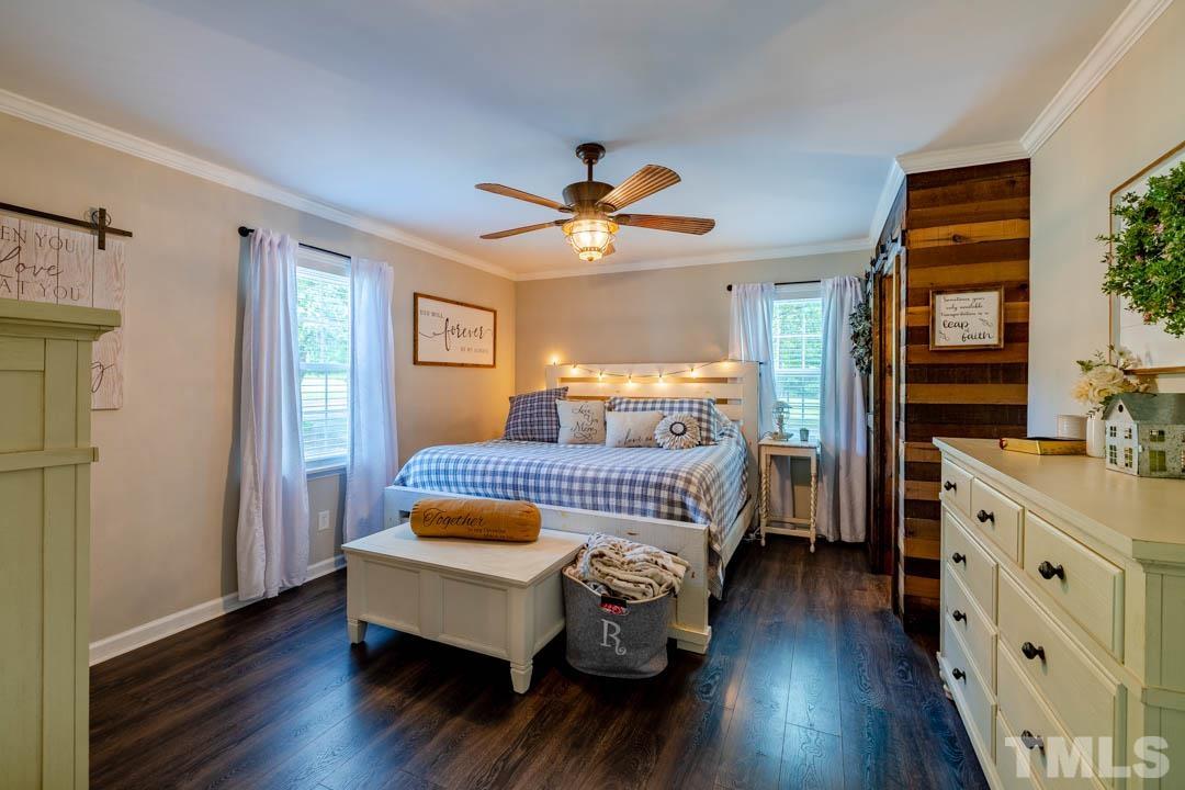 9622 Sawyer Road Rougemont, NC 27572 - Photo 20 of 34 a bedroom with a bed and wooden floor