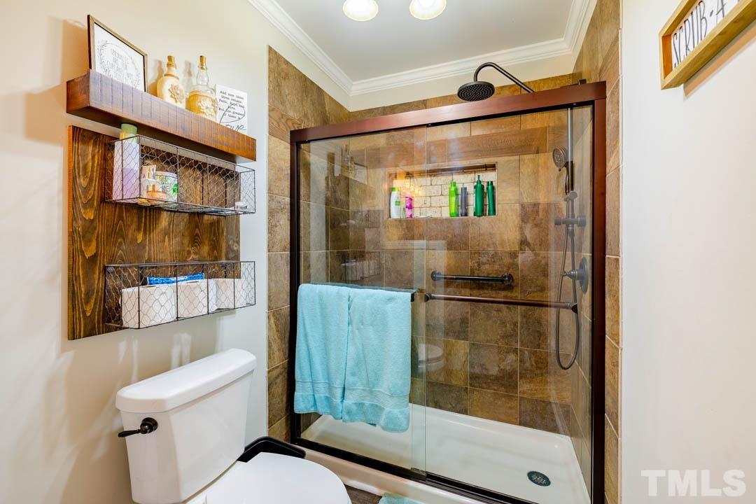 9622 Sawyer Road Rougemont, NC 27572 - Photo 23 of 34 a bathroom with a toilet and a shower