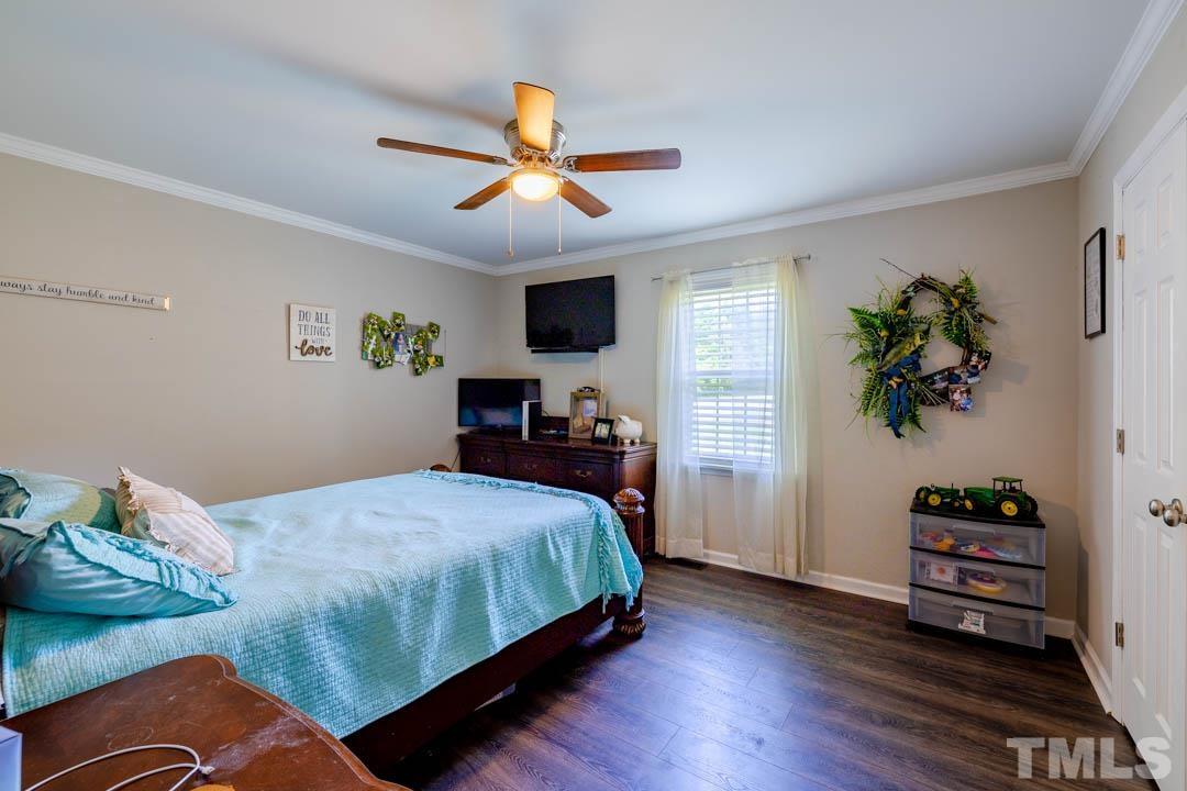 9622 Sawyer Road Rougemont, NC 27572 - Photo 24 of 34 a bedroom with a bed dresser and a window