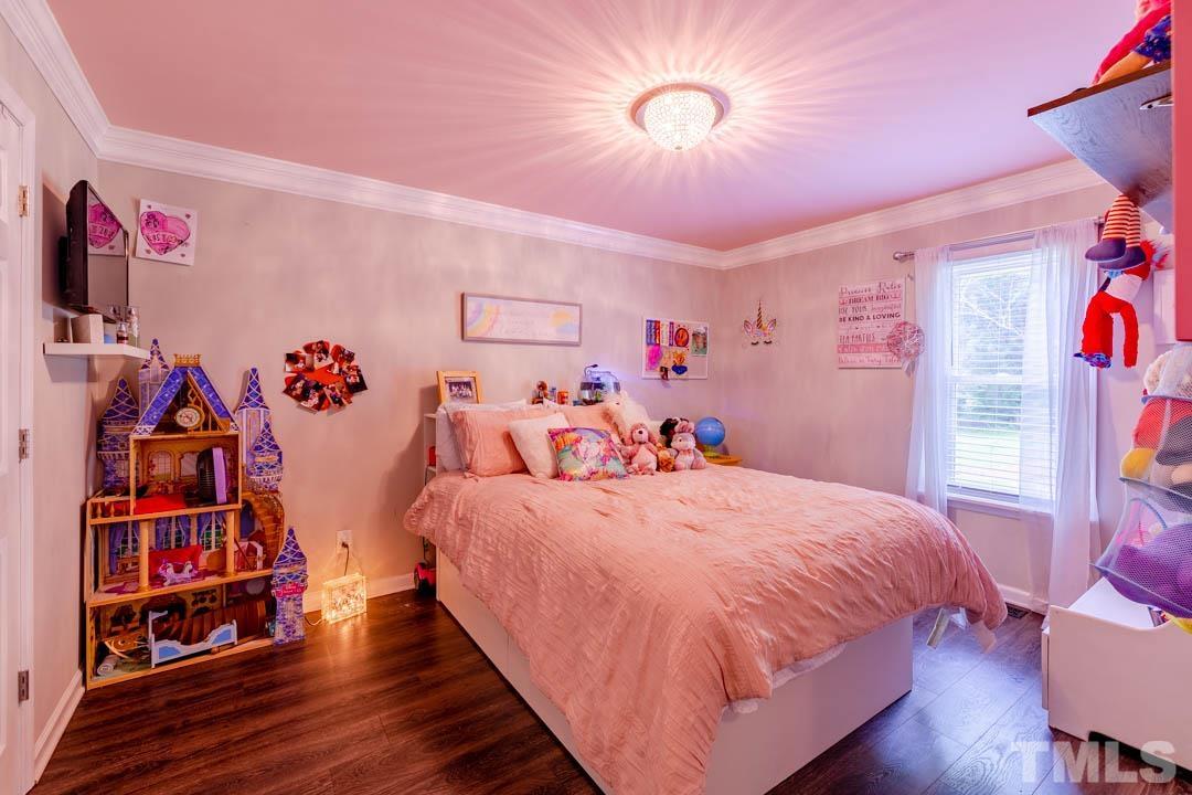 9622 Sawyer Road Rougemont, NC 27572 - Photo 26 of 34 a bed room with a bed and a book shelf
