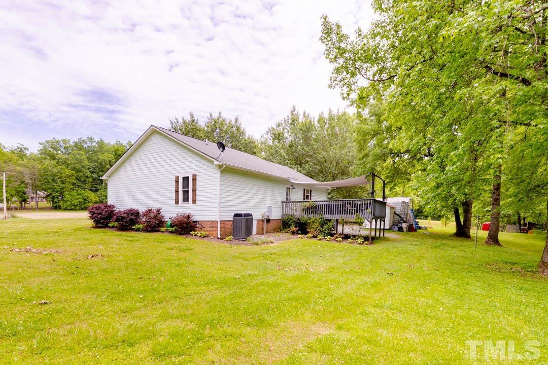 9622 Sawyer Road Rougemont, NC 27572 - Photo 28 of 34 a view of a house with patio and yard