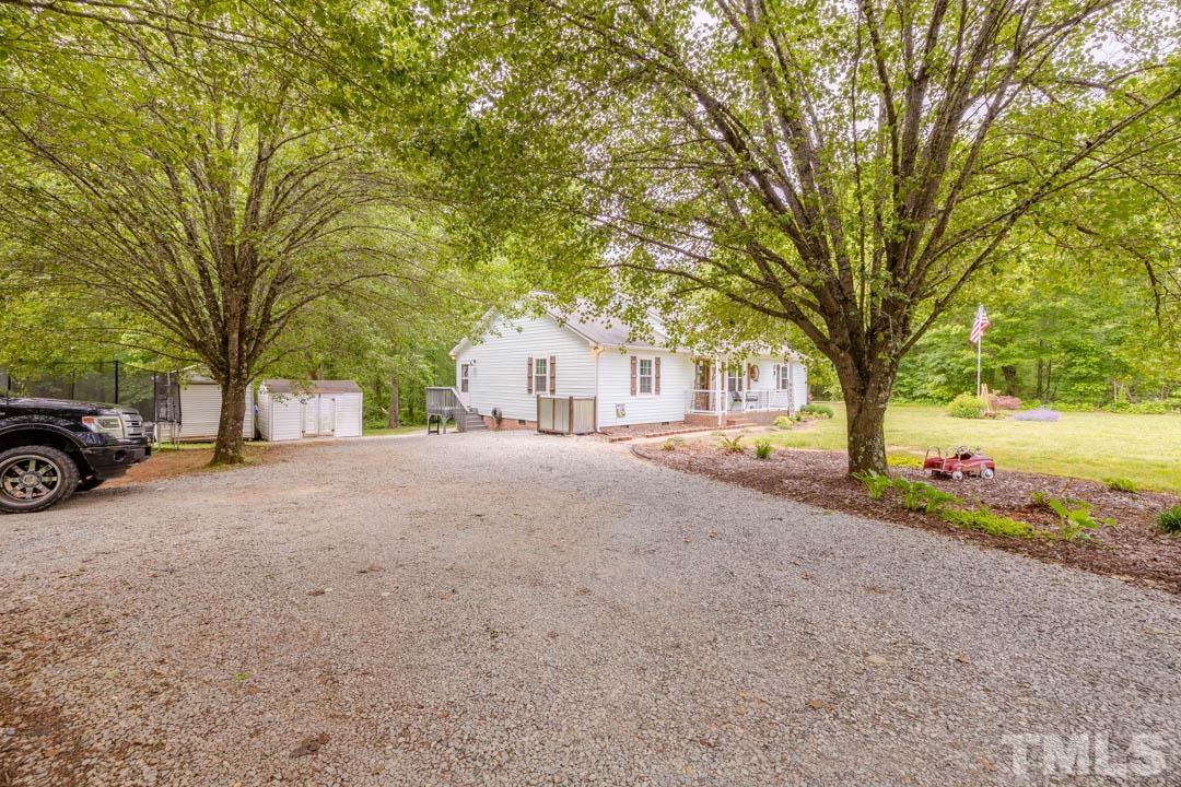 9622 Sawyer Road Rougemont, NC 27572 - Photo 34 of 34 a view of a house with a yard and garage