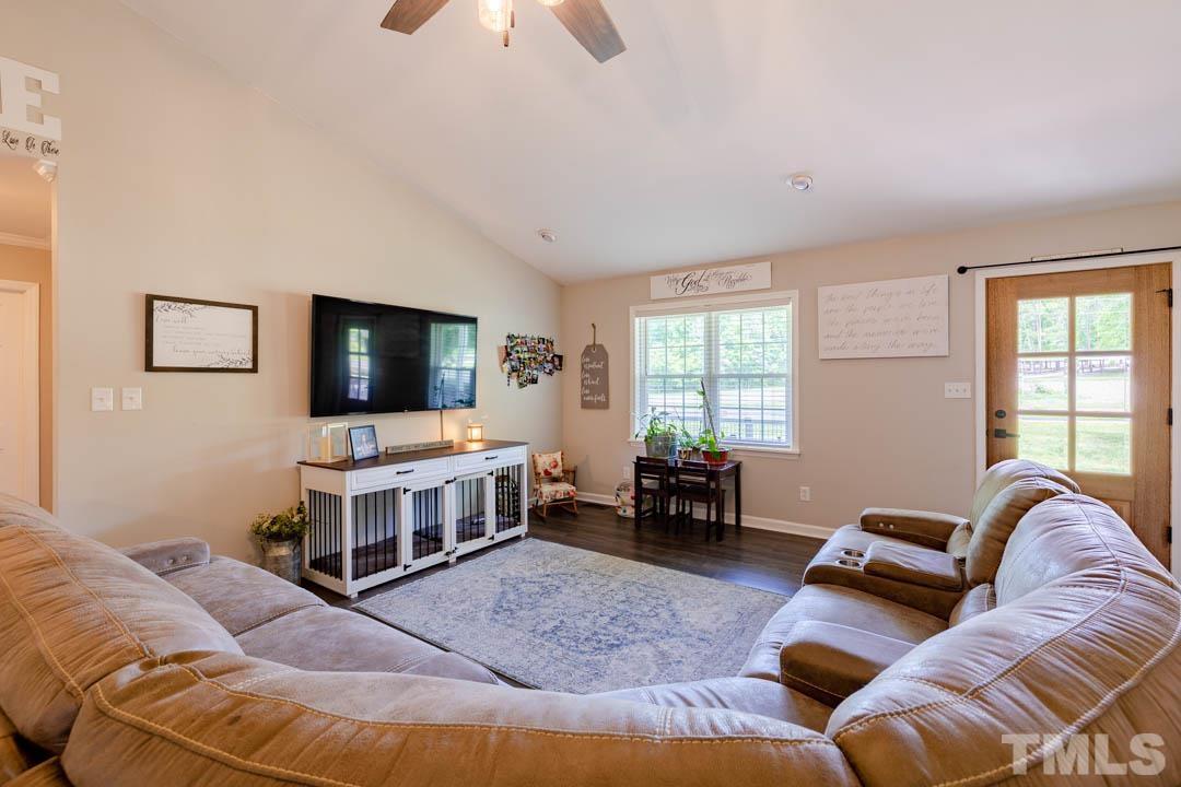 9622 Sawyer Road Rougemont, NC 27572 - Photo 5 of 34 a living room with furniture and a flat screen tv