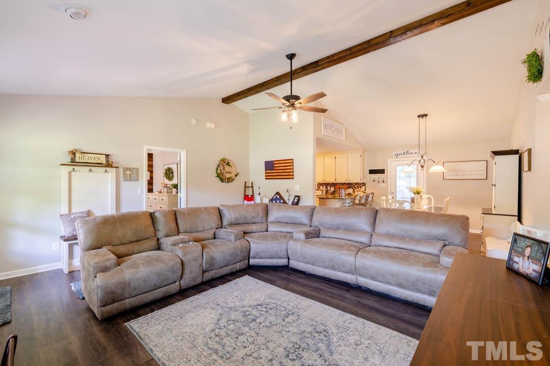 9622 Sawyer Road Rougemont, NC 27572 - Photo 7 of 34 a living room with furniture and a chandelier