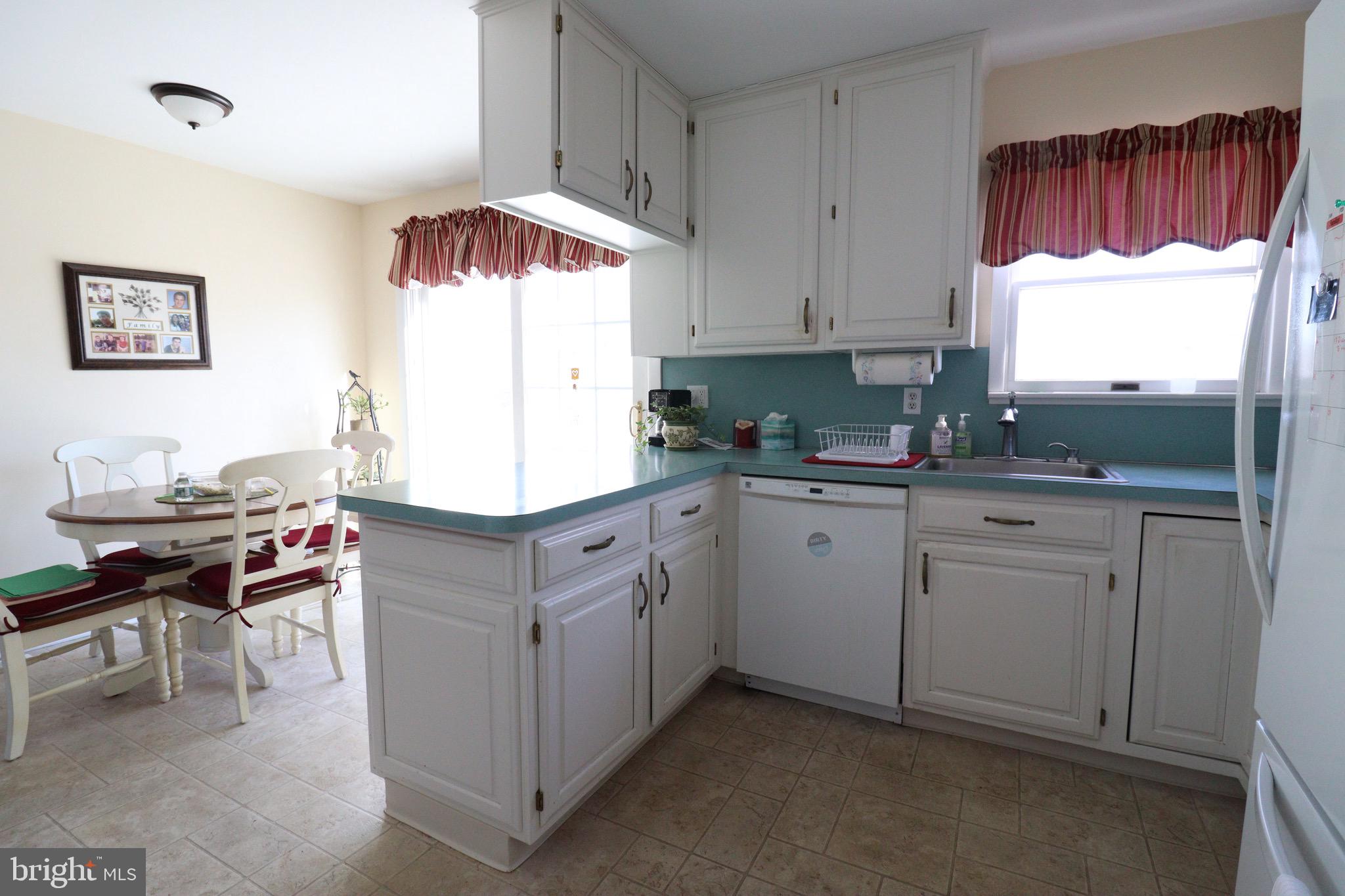 56 Sherbrooke Road Trenton, NJ 08638 - Photo 19 of 31 a kitchen with cabinets and window