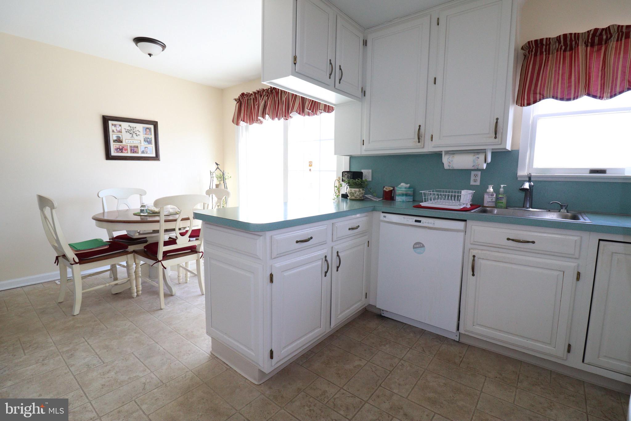56 Sherbrooke Road Trenton, NJ 08638 - Photo 20 of 31 a kitchen that has a lot of cabinets in it and white appliances
