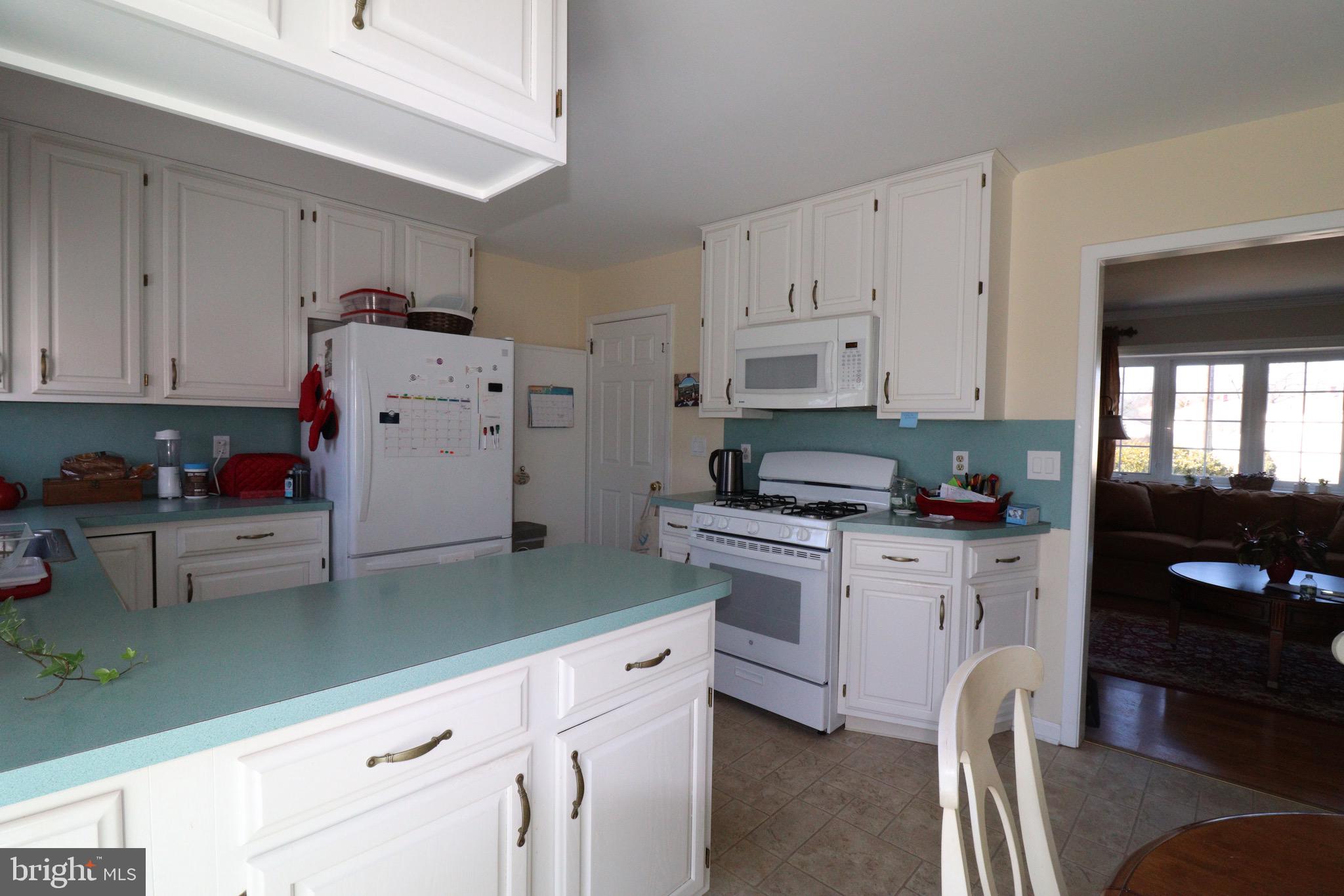 56 Sherbrooke Road Trenton, NJ 08638 - Photo 22 of 31 a kitchen with granite countertop a sink cabinets stainless steel appliances and a counter space