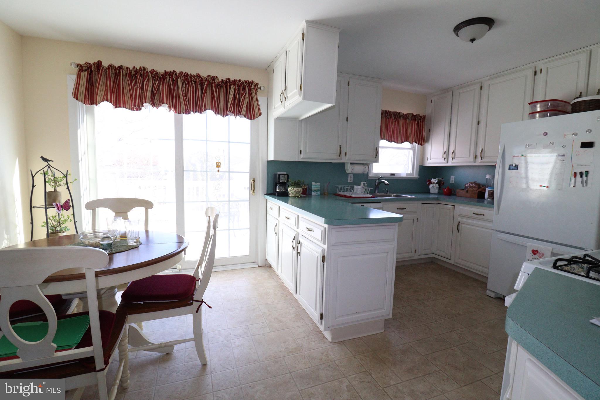 56 Sherbrooke Road Trenton, NJ 08638 - Photo 23 of 31 a kitchen with a sink a window and appliances