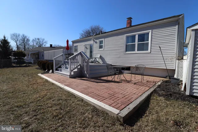 a view of a backyard with sitting area