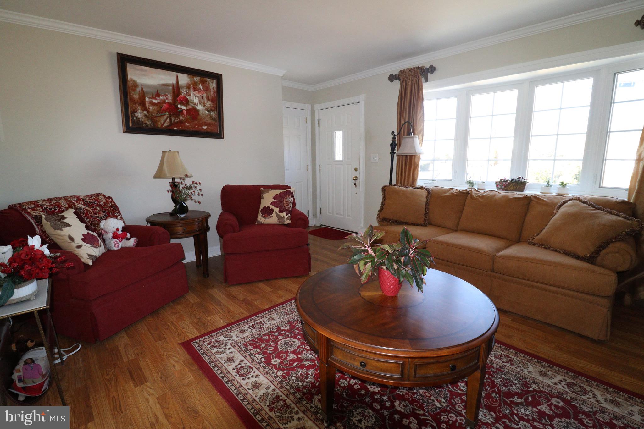 56 Sherbrooke Road Trenton, NJ 08638 - Photo 4 of 31 a living room with furniture a rug and a large window