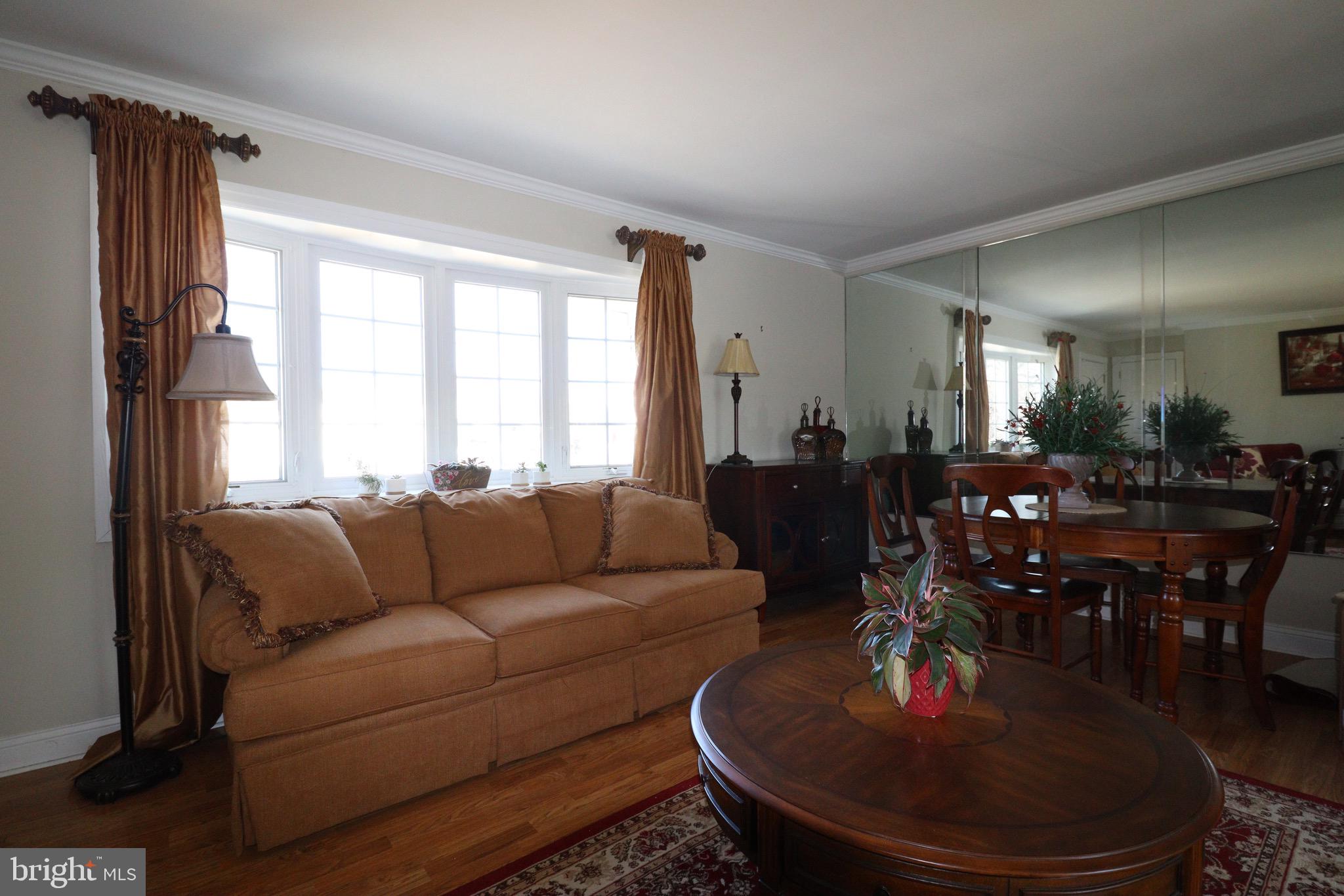 56 Sherbrooke Road Trenton, NJ 08638 - Photo 5 of 31 a living room with furniture and a large window