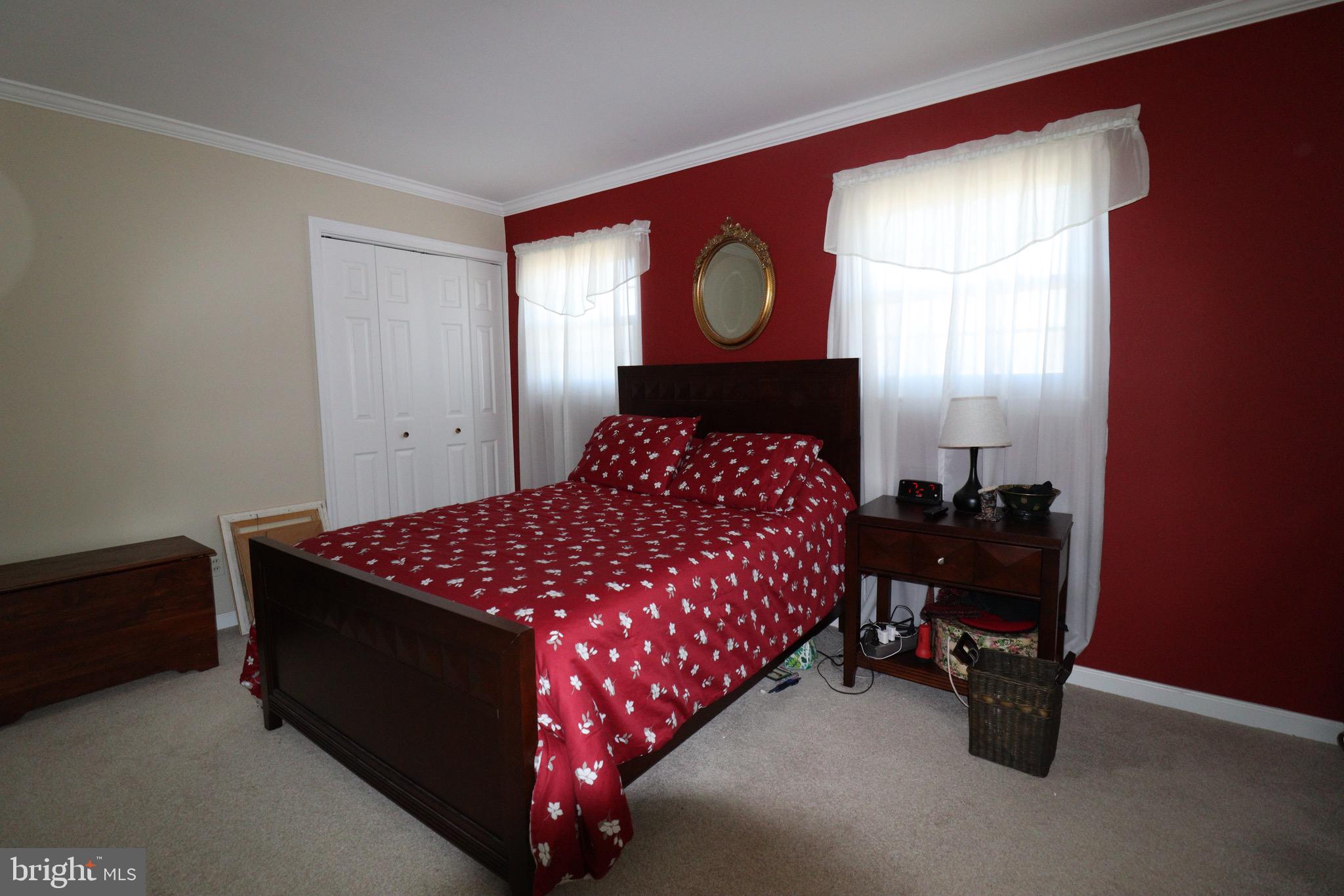 56 Sherbrooke Road Trenton, NJ 08638 - Photo 9 of 31 a bed room with a bed and a mirror