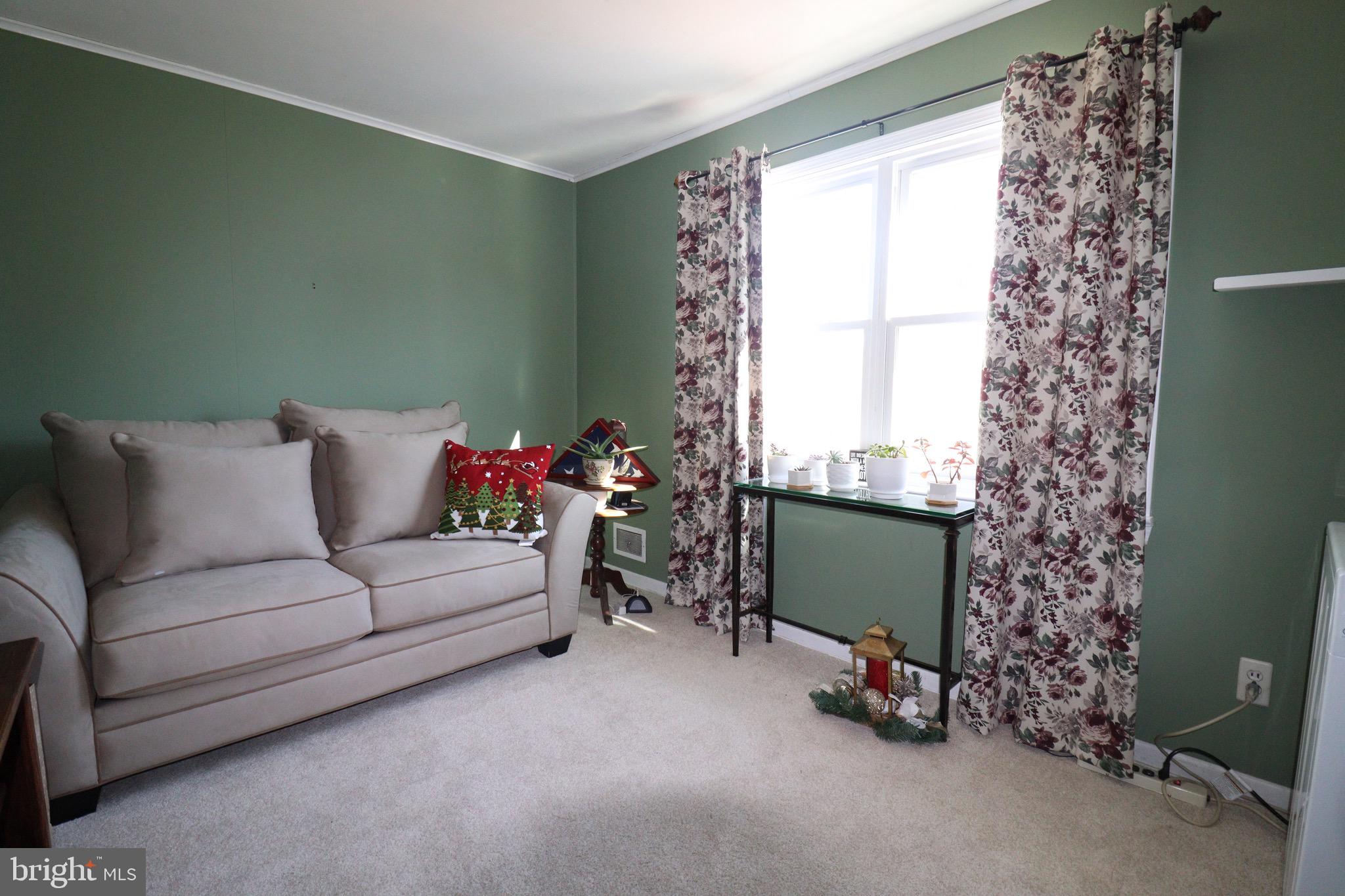 56 Sherbrooke Road Trenton, NJ 08638 - Photo 10 of 31 a living room with furniture and a window