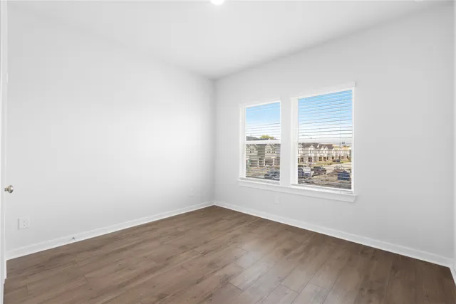 a view of a chair and table in the garden
